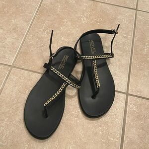 Black flat sandals with chain detail. Back strap. Size 10
